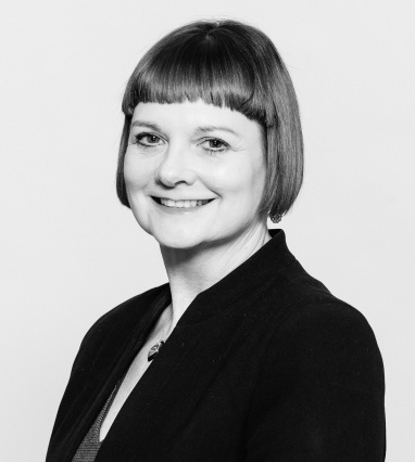 A head and shoulders photo of Annmarie Hassall MBE