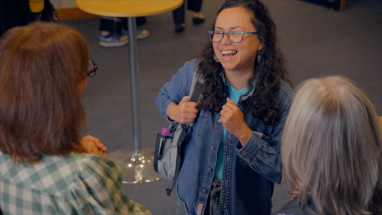 People chatting at Empowering Young People event