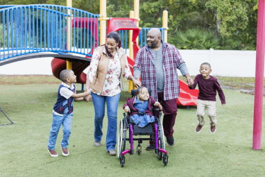 Family walking through a playground