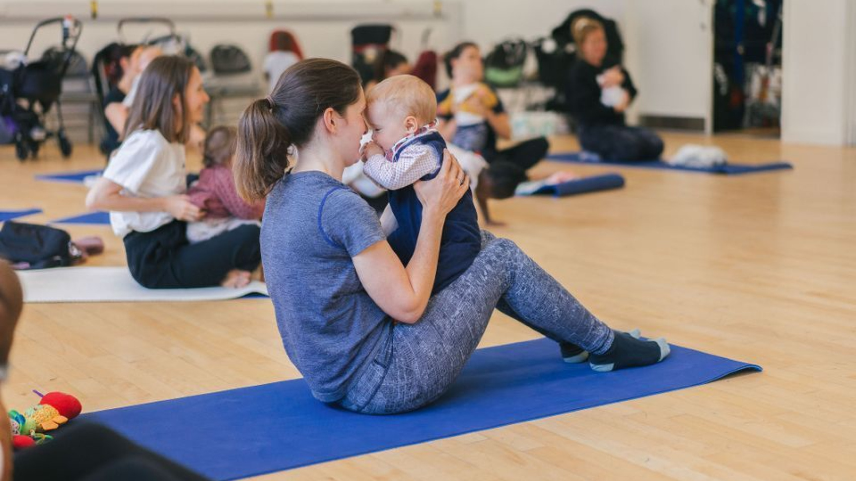 Mothers and babies doing a yoga class