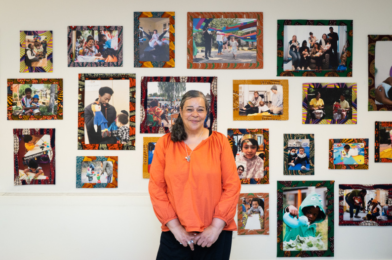 Laura McFarlane stood in front of LEAP exhibition photos