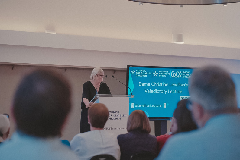 Dame Christine Lenehan speaking in front of an audience