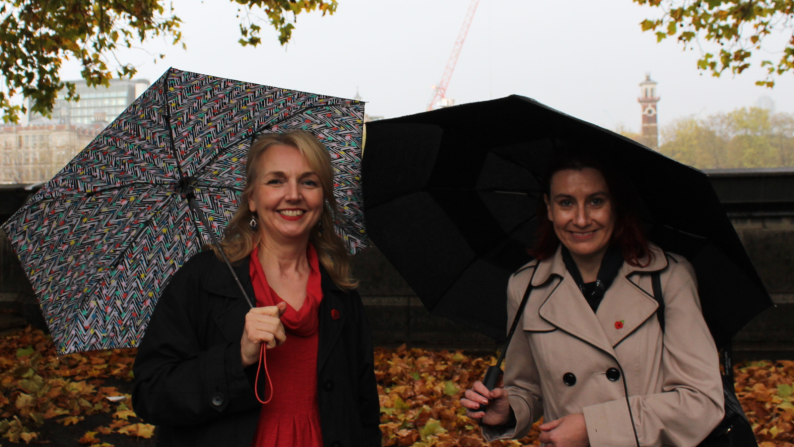 Two smiling parents from the families research advisory group