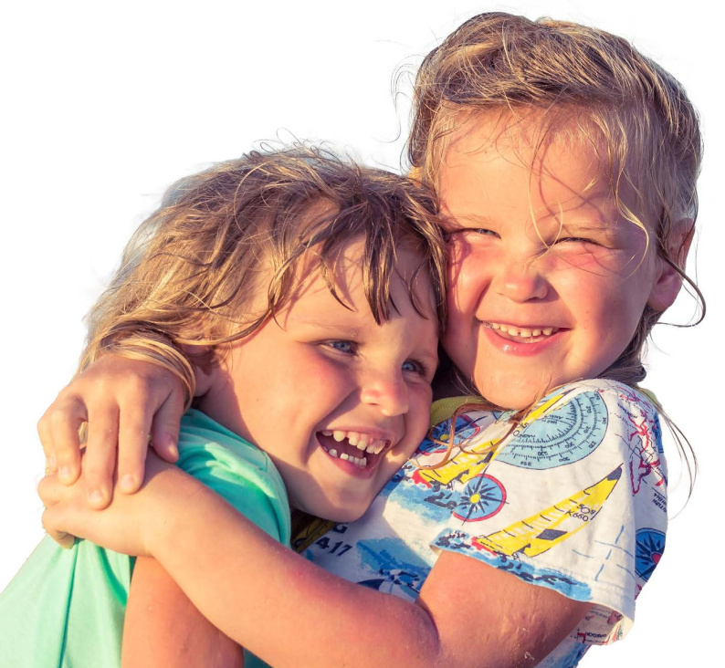 Children smiling and hugging each other