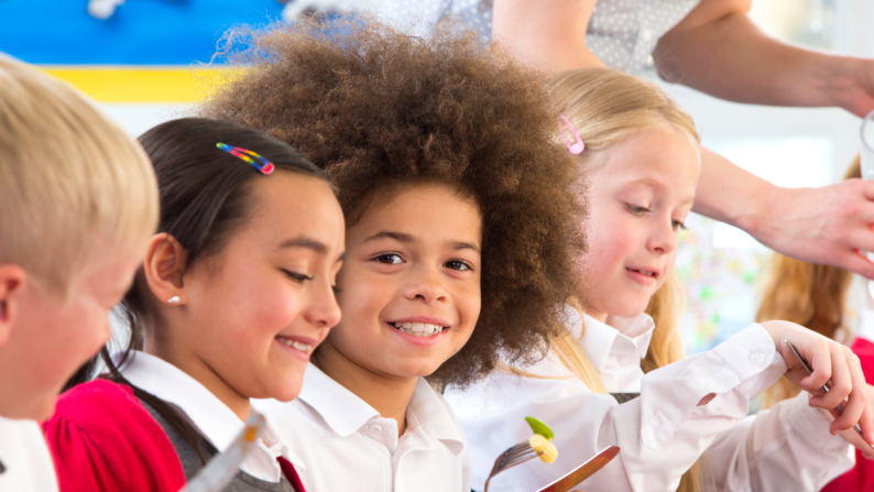 Pupils at school smiling