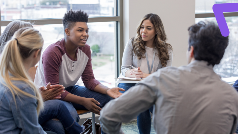 group of teenagers and young people talking
