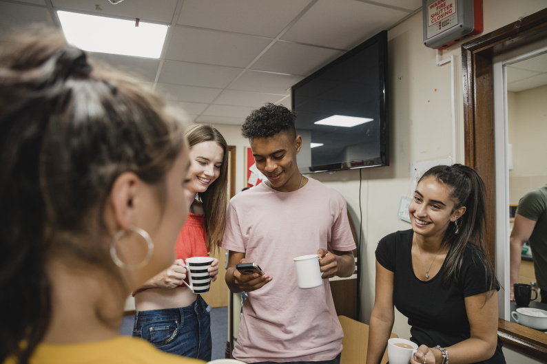 Teenagers talking and laughing together